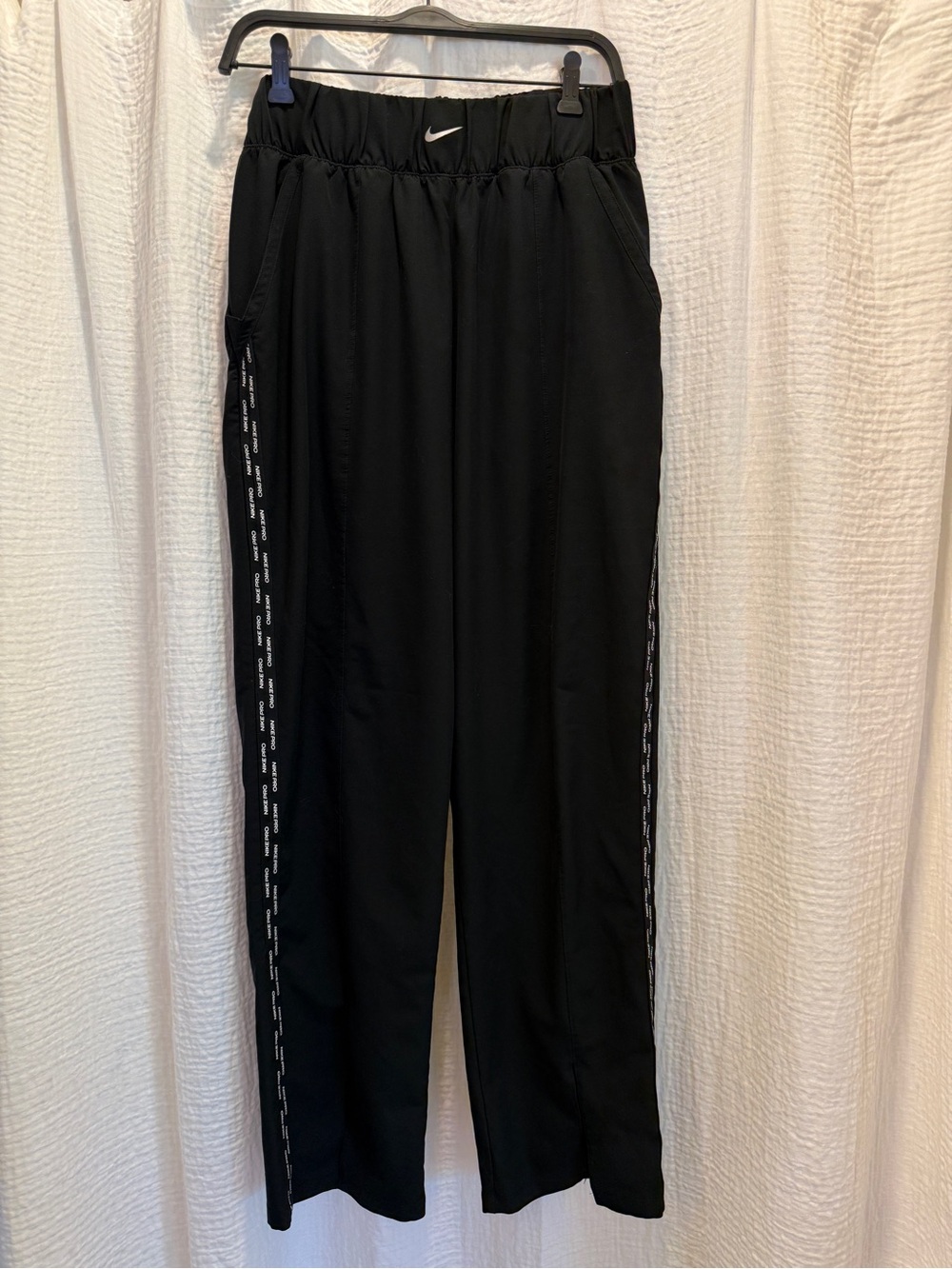 Nike Black Track Pants with White Swoosh and Side Tape